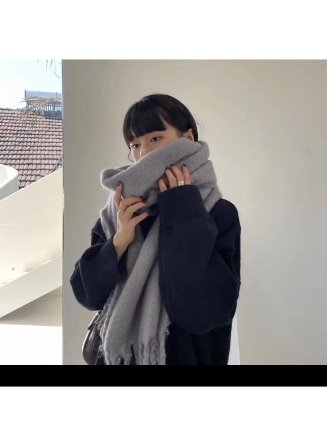 Luxuria A stylish, light gray, one-piece women's scarf, perfect for autumn and winter. This thick, double-sided scarf is warm and cozy, ideal for the office or everyday wear. A classic scarf to keep you warm, this large, curly gray scarf is a popular and warm winter accessory. - Image 3